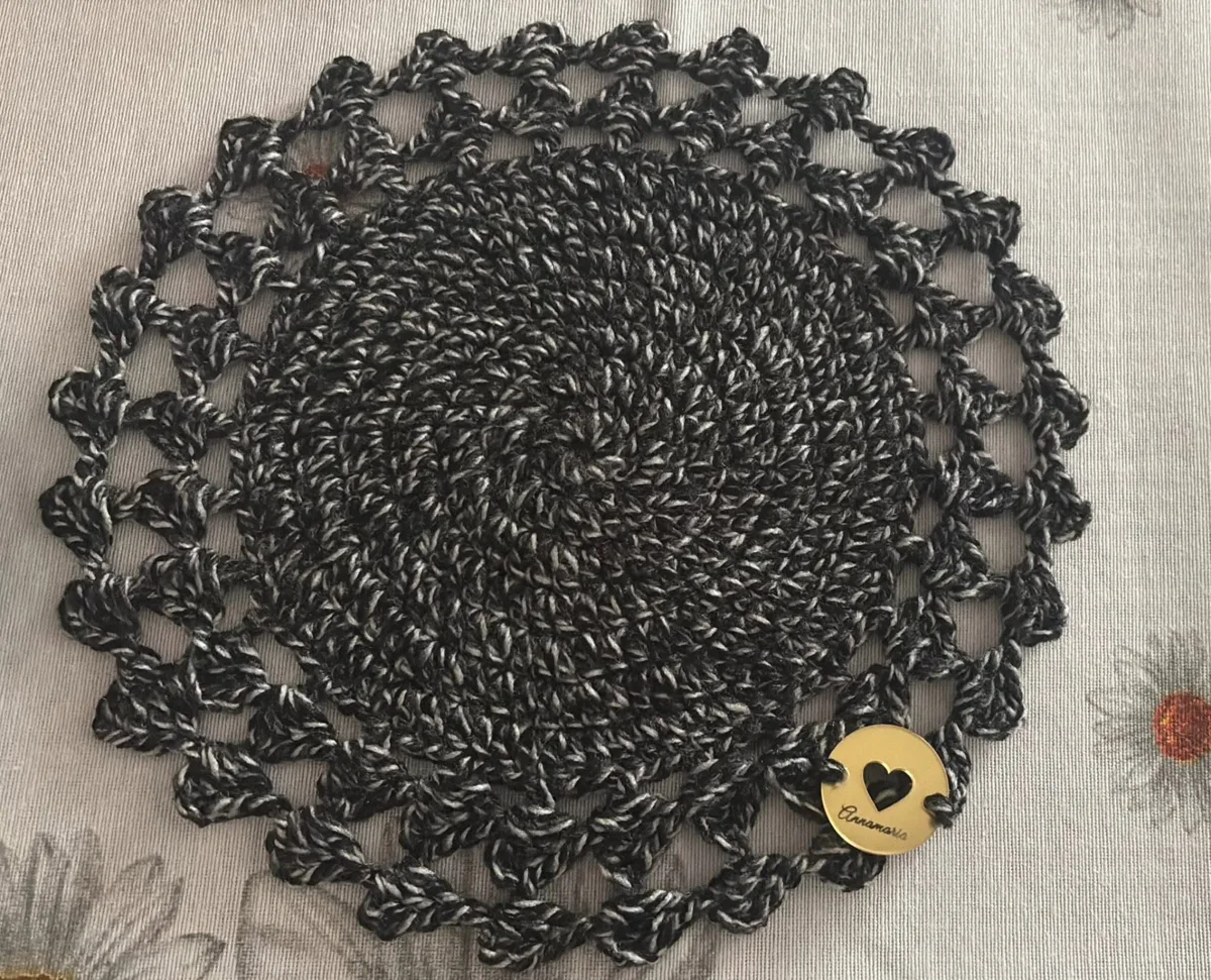 Charcoal lace doily Charcoal lace doily, handmade crochet by Atelier Annamaria. Round black and grey doily with an open lace border.