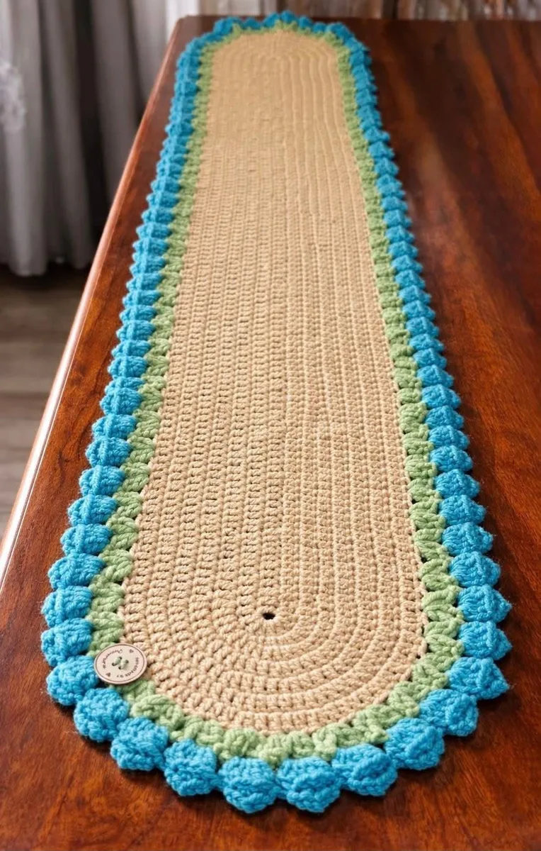 Seaside table runner Seaside table runner, handmade crochet by Atelier Annamaria. Long beige runner with green and turquoise bobble edging.