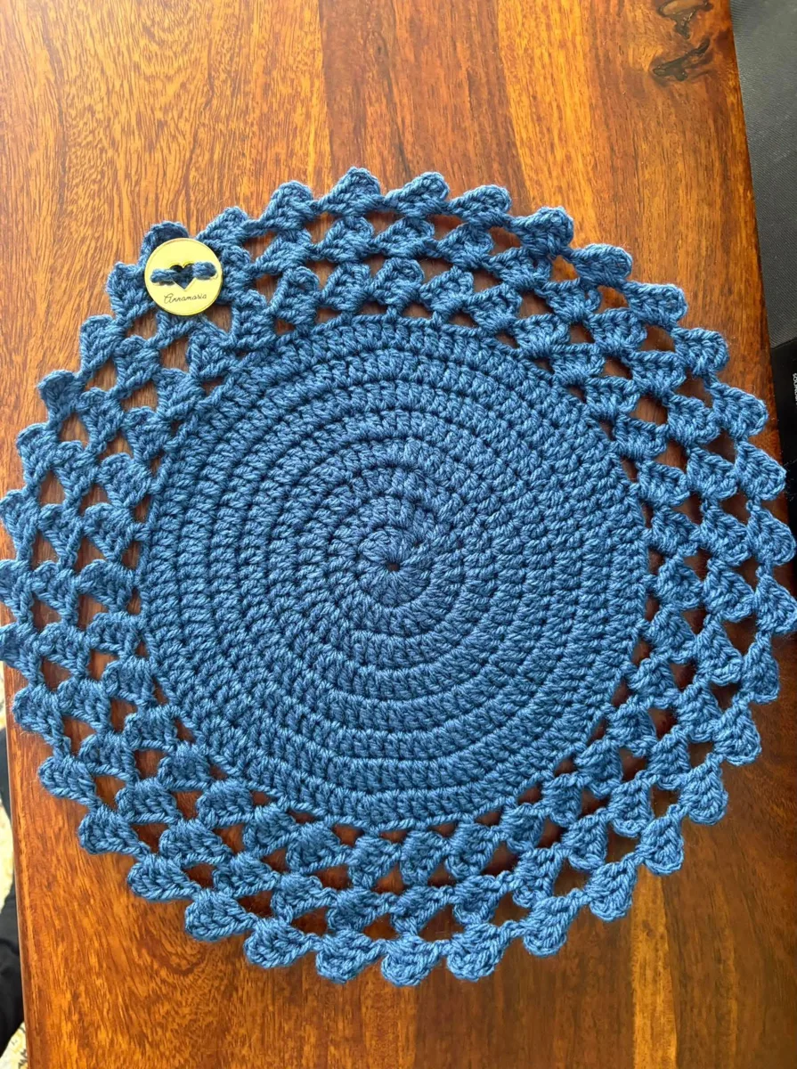 Ocean blue placemat Ocean blue placemat, handmade crochet by Atelier Annamaria. Round blue placemat with a lacy scalloped border.