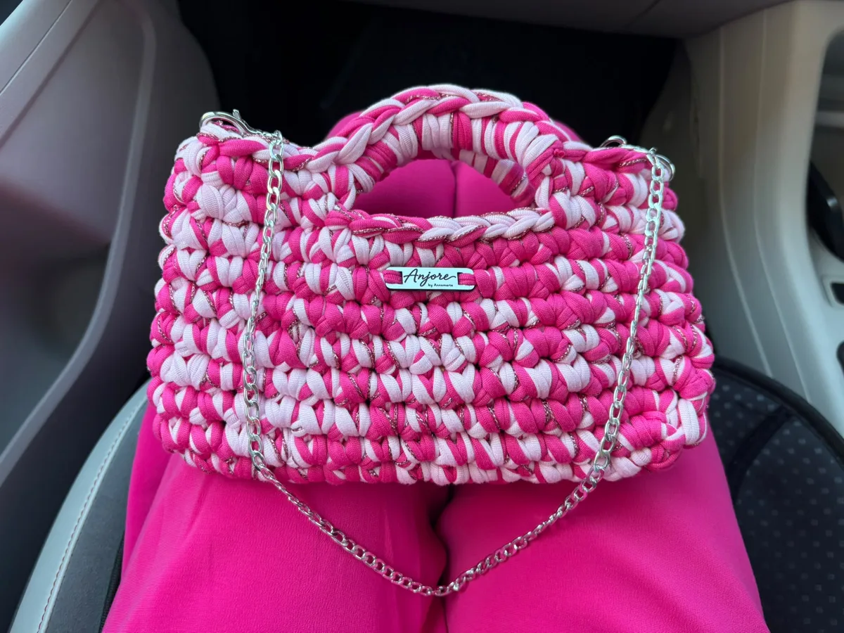 Anjore Pink marble bag Anjore Pink marble bag, handmade crochet by Atelier Annamaria. Pink and white marbled bag with a silver chain.