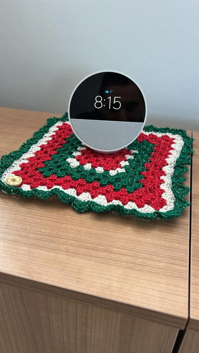 Festive square mat Festive square mat, handmade crochet by Atelier Annamaria. Red, green and white mat with a golden sparkle.